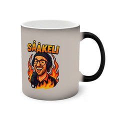 Mug with a graphic of a person wearing headphones and flames, along with the text 'sååkeli'.