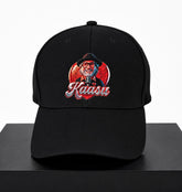 Black cap with embroidered design and 'Kaasu' text on a white background