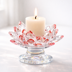 Decorative glass candle holder with a lit candle on a white background