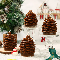 Chocolate pine cone candles on a festive background with Christmas decorations.