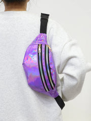 Person wearing a purple reflective bag with black straps on a white background