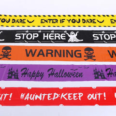 Set of Halloween-themed caution tapes with text and graphics on a white background