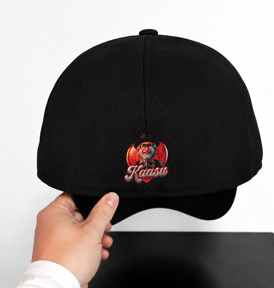 Black cap with embroidered design held by a hand on a white background