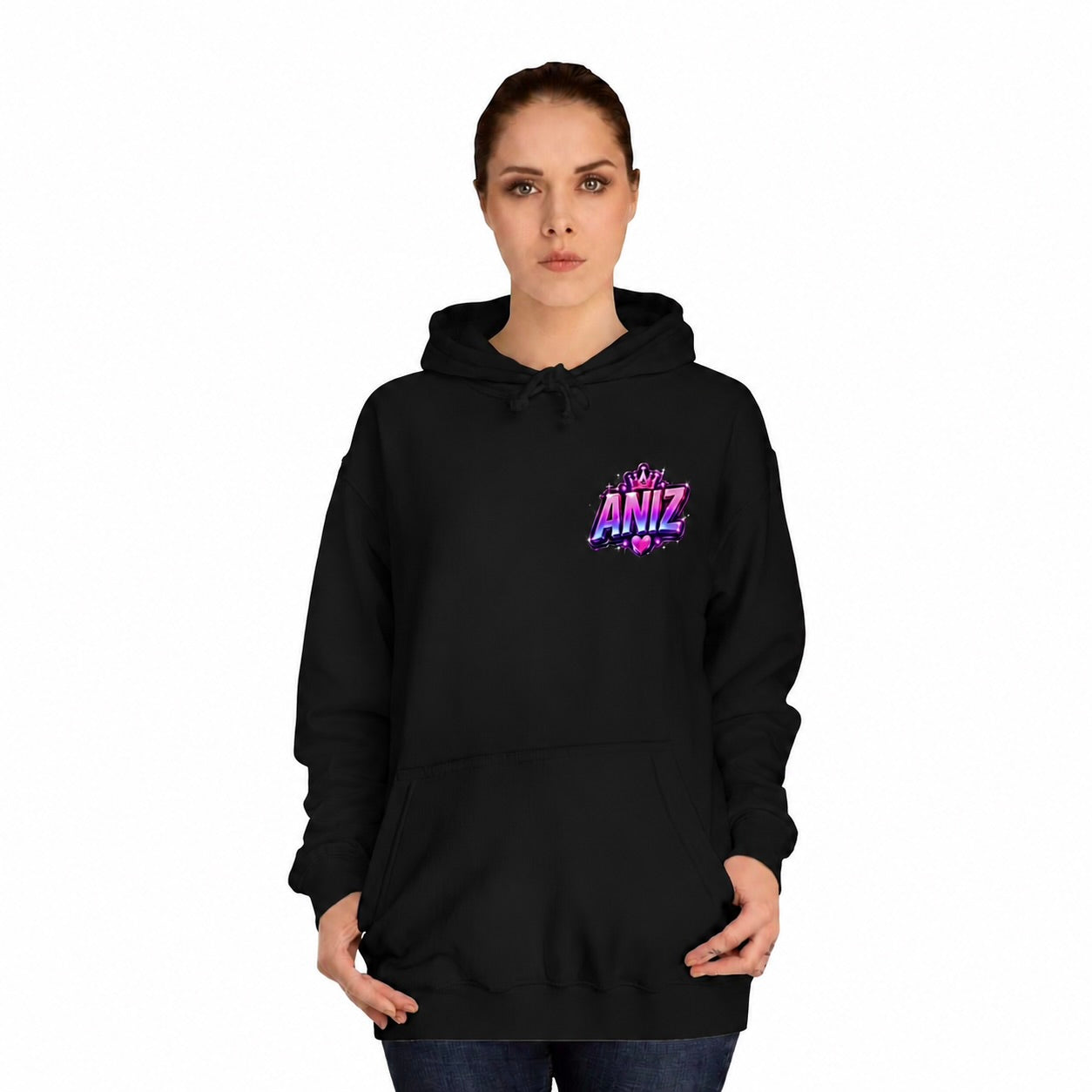 A woman modeling a black pullover hoodie with a colorful graphic on the left chest that reads 'Be My ANIZ'. The background is solid white.