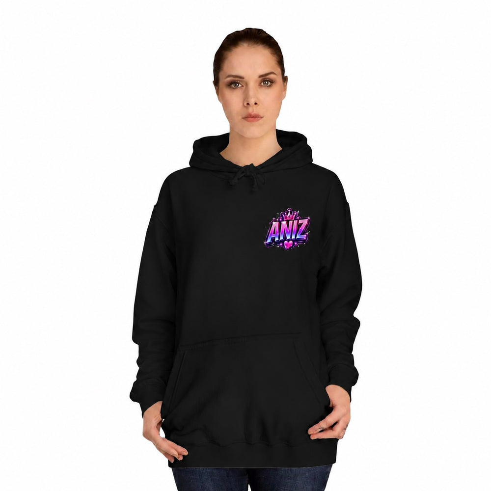 A woman modeling a black pullover hoodie with a colorful graphic on the left chest that reads 'Be My ANIZ'. The background is solid white.