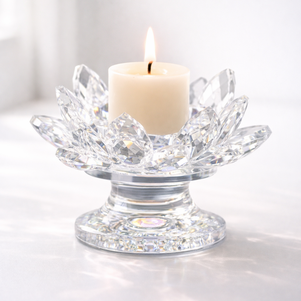 Crystal lotus candle holder with a lit candle on a white background