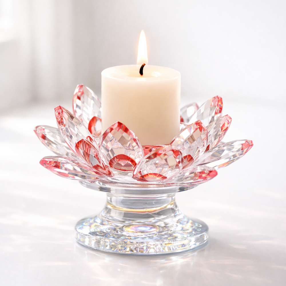 Decorative glass candle holder with a lit candle on a white background