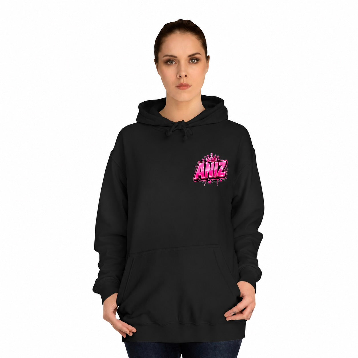 A woman modeling a black pullover hoodie with a pink and purple 'ANIZ' graphic on the left chest, set against a plain white background.