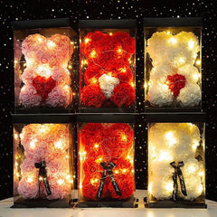Six decorative bears made of flowers with lights on a dark background