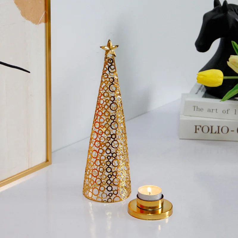 Decorative gold cone with a candle on a white surface