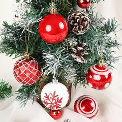 Decorative Christmas tree with red and white ornaments and pine cones.
