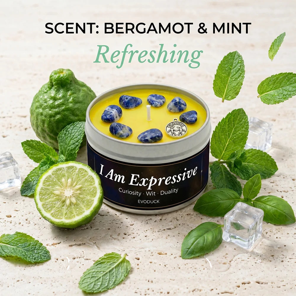 Candle with bergamot and mint scent surrounded by green leaves and a lime on a light background.
