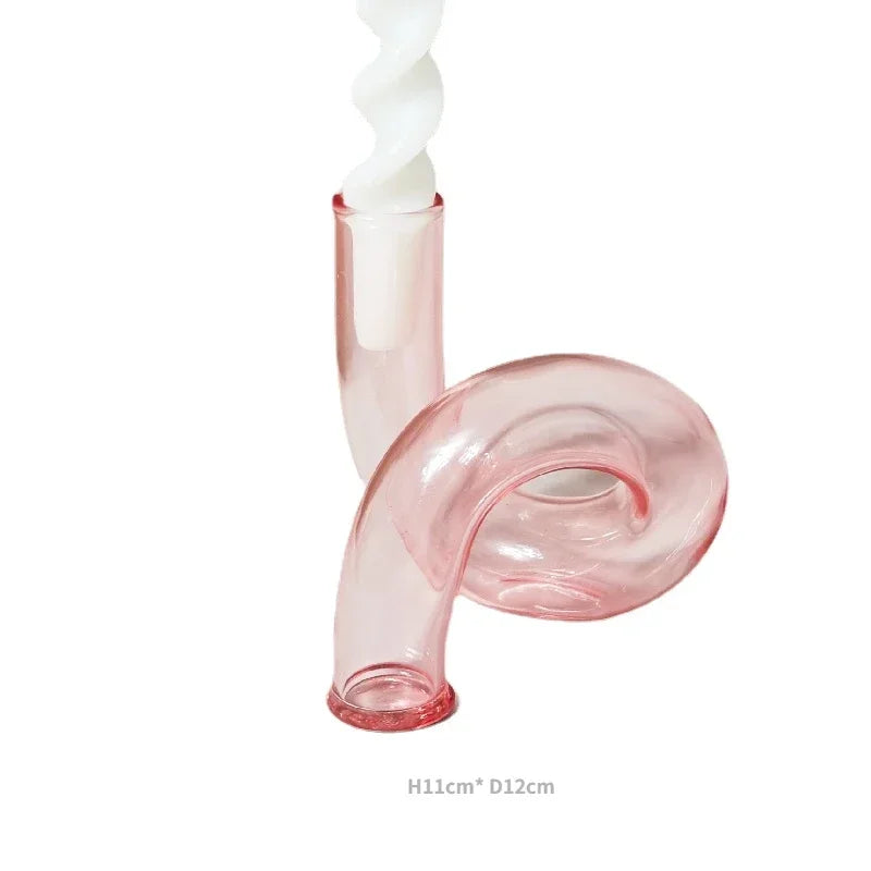 Pink glass pipe with white spiral on a white background