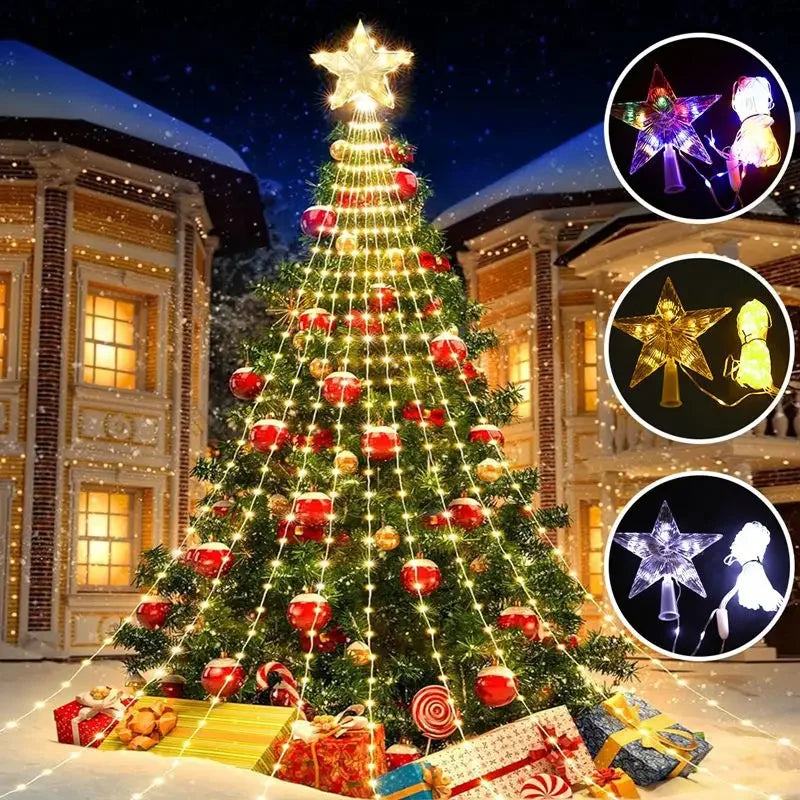 Decorated Christmas tree with lights and presents in front of a building at night.