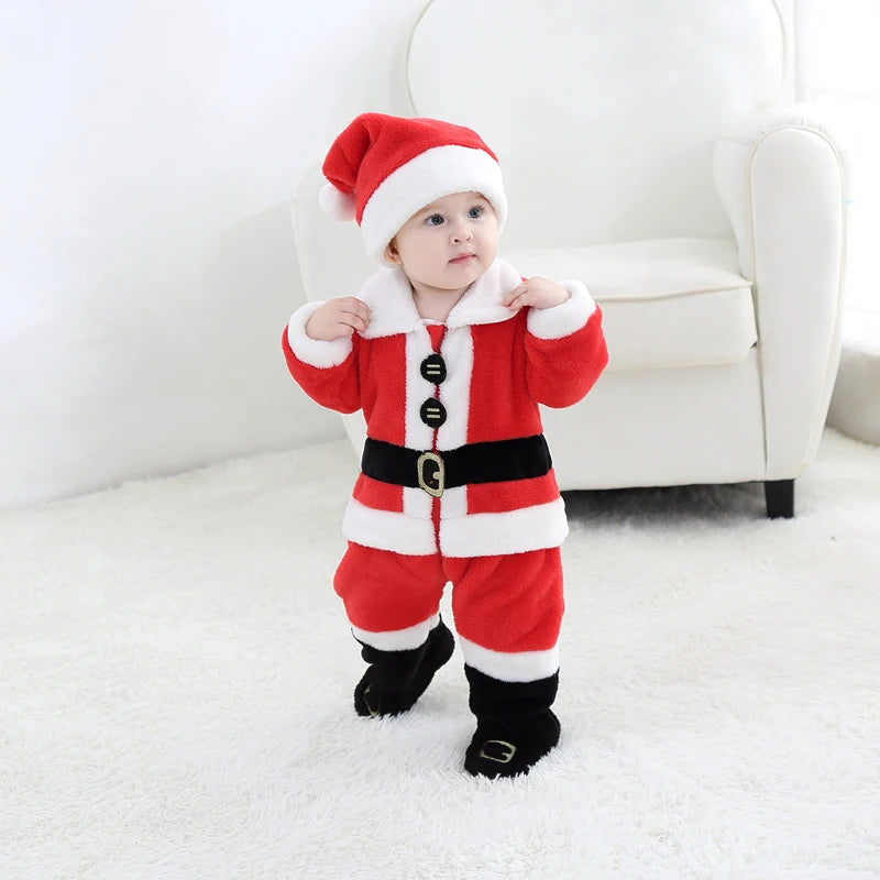 Baby wearing a red Santa Claus outfit with a white background