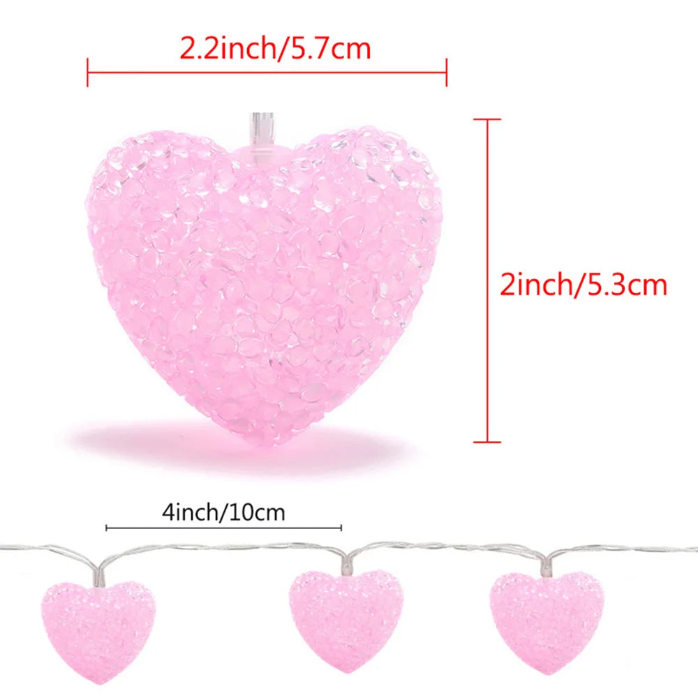 Pink heart-shaped lights with measurements on a white background