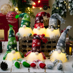 Set of LED gnome figurines with colorful hats and outfits on a festive background.