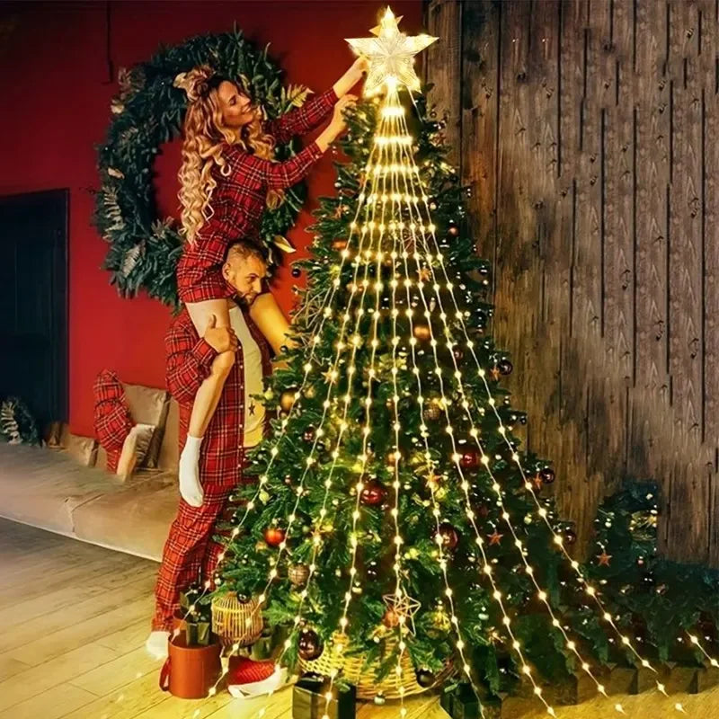 Two people decorating a Christmas tree with lights and ornaments in a cozy living room.
