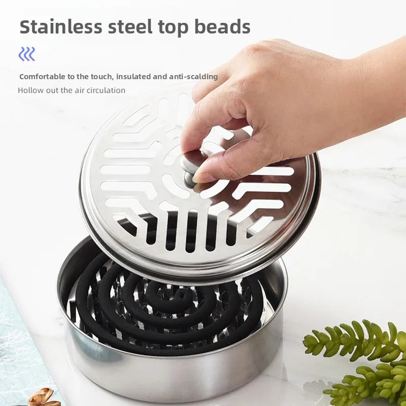 Stainless steel top beads with a hand interacting with it on a light background