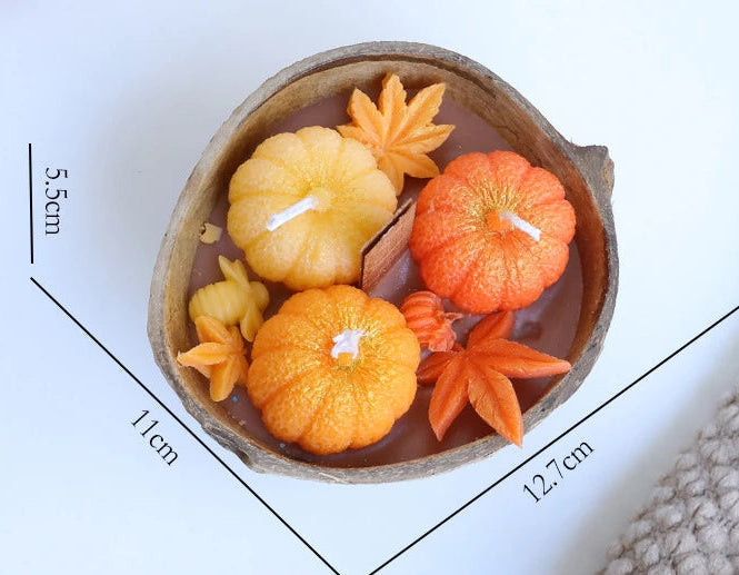 A decorative candle in a rustic brown bowl filled with orange and yellow autumn-themed wax pieces, shown with dimension lines