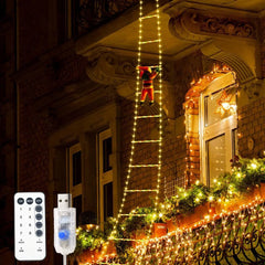 Decorative string lights on a building exterior with remote control and power adapter.