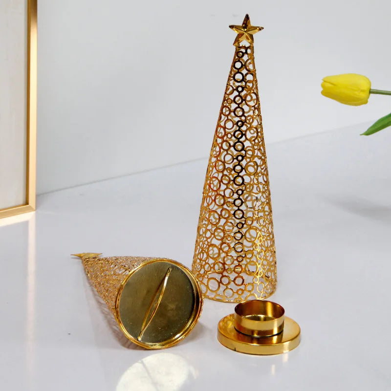 Decorative gold cone-shaped candle holder with star on a white surface.