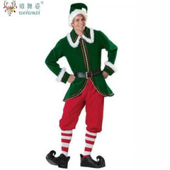 Person wearing a green elf costume with red pants on a white background